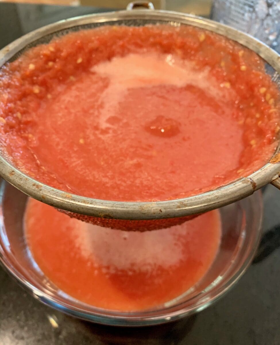 straining the tomato base