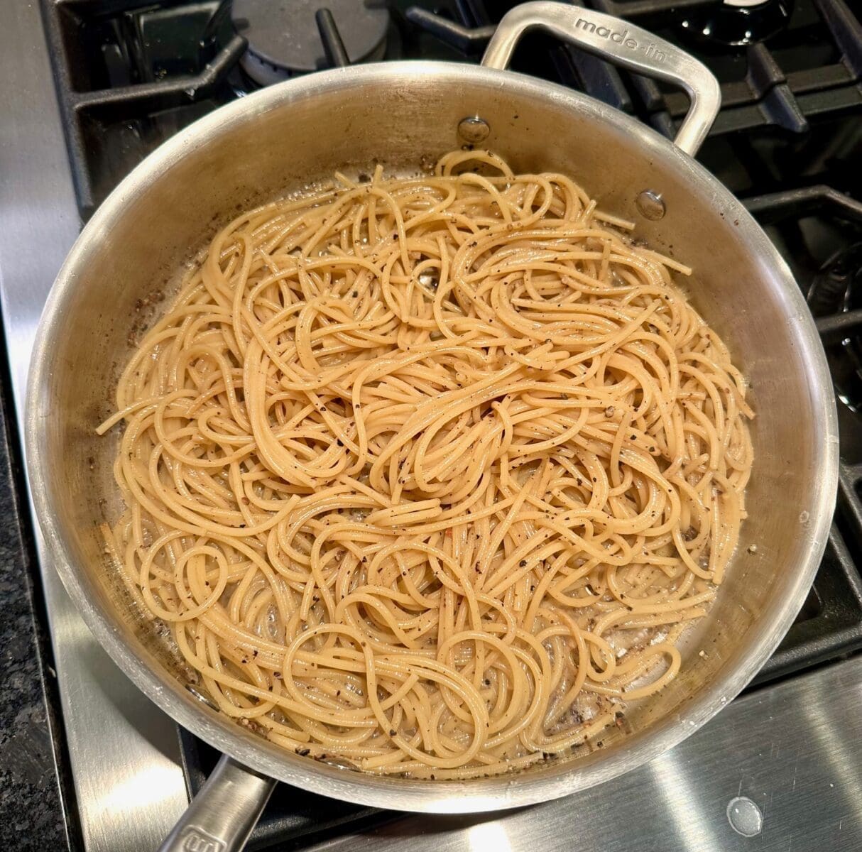 cooking the pasta in the butter sauce