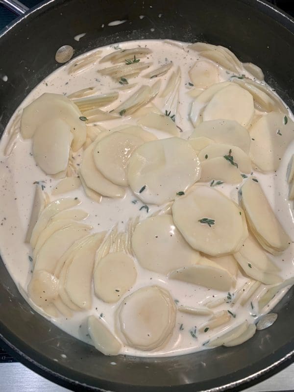scalloped potatoes in cream milk and seasoning
