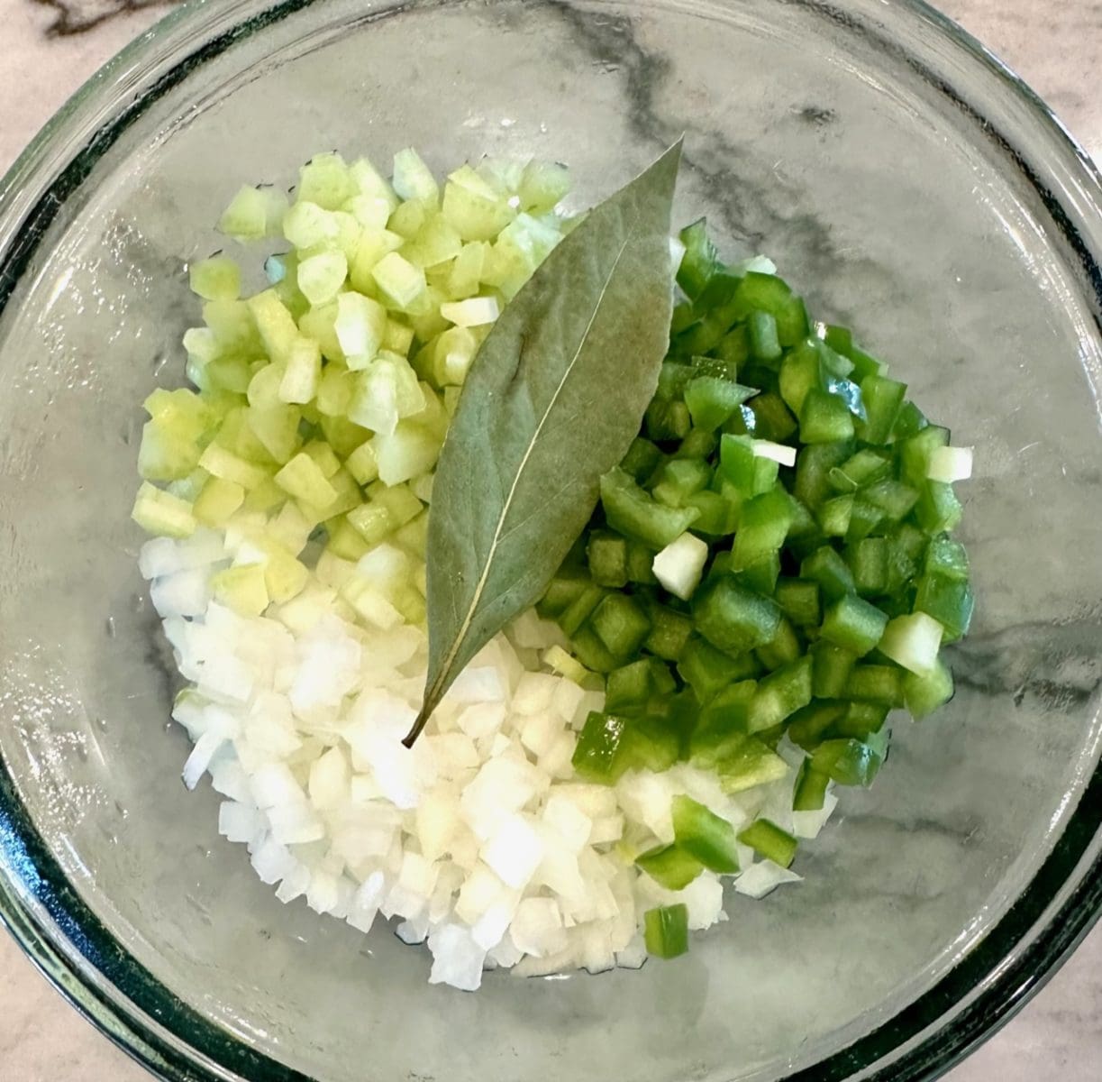diced onion celery bell pepper and bay leaf