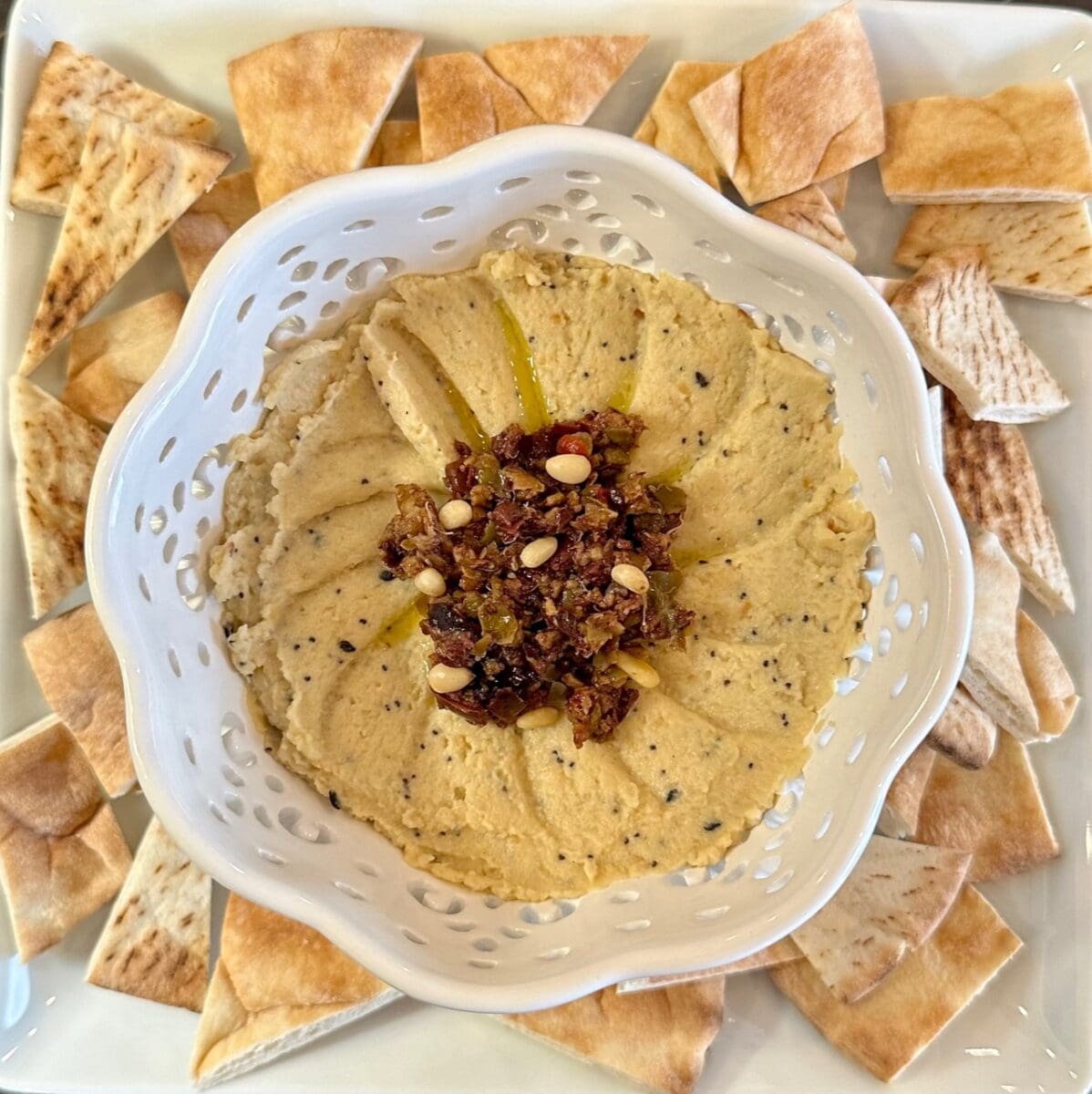 everything bagel hummus with olive tapenade