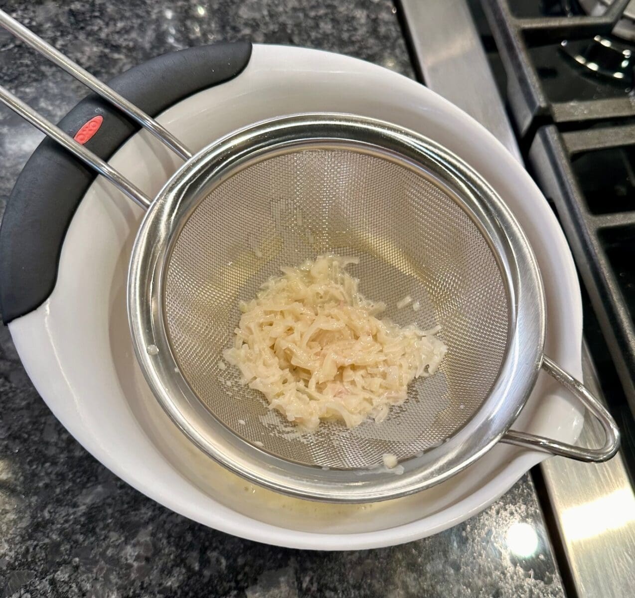 straining the beurre blanc sauce
