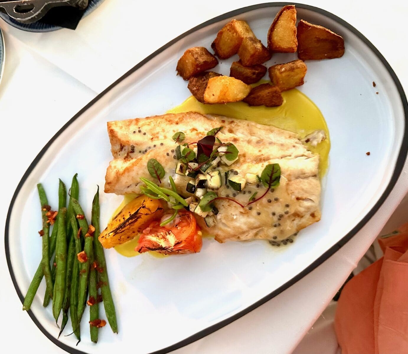 the dining room at little palm island yellowtail snapper