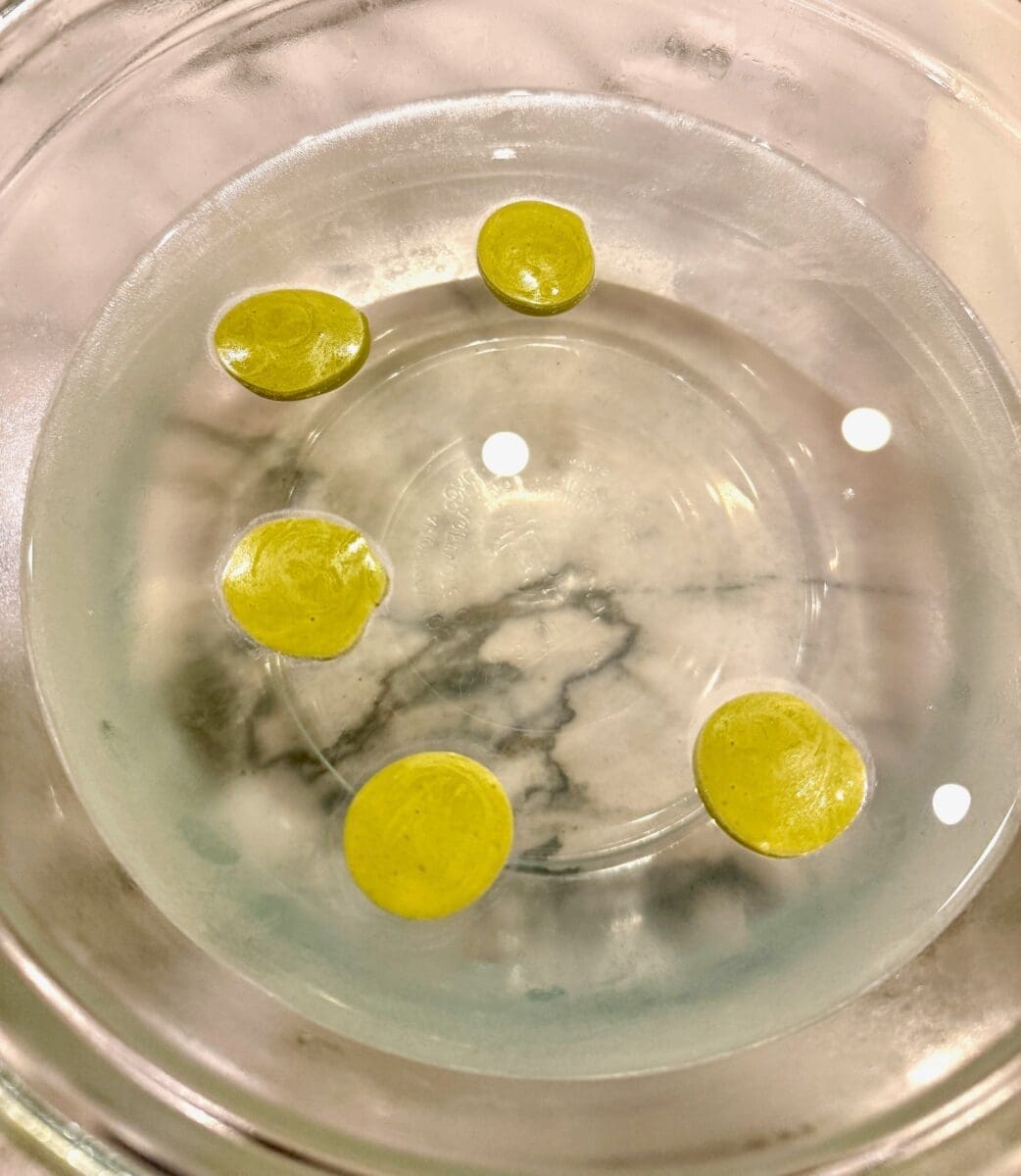 olives cooking in the alginate bath